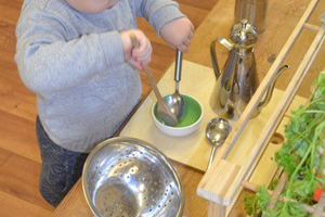 child at Care Chiefs Nursery playing with kitchen tools