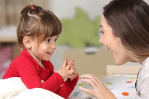 happy girl talking to practitioner