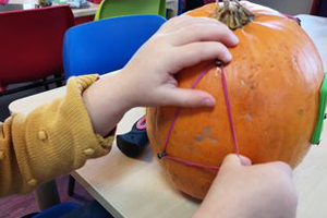 the old forge day nurseriy making marks in pumkin