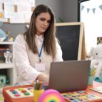 Marketing your nursery: Nursery teacher on laptop