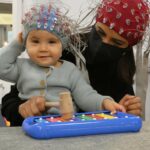 Child playing on a xylophone