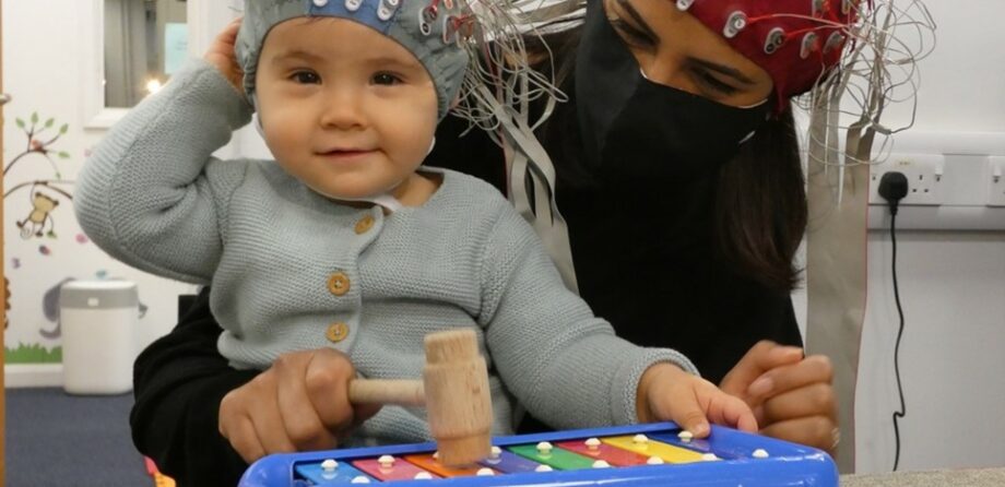 Child playing on a xylophone