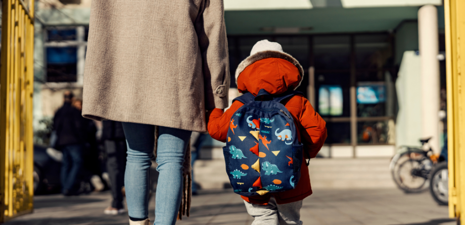 child and parent walking to nursery