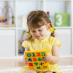 Maths in early years - child doing maths at nursery