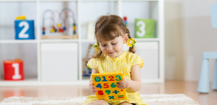 Maths in early years - child doing maths at nursery