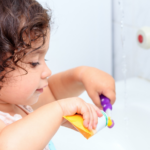 Oral health in early years - child brushing teeth